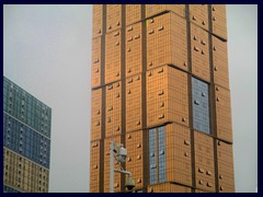 Golden skyscraper opposite WoW in Overseas Chinese Town (OCT), Nanshan district.